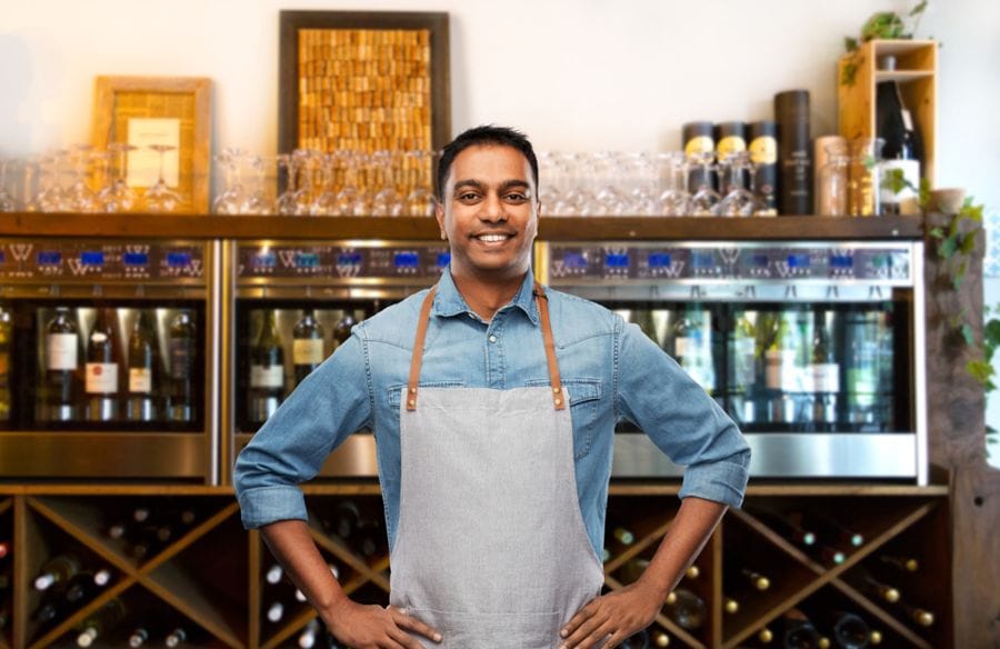 Independent shop owner in his store