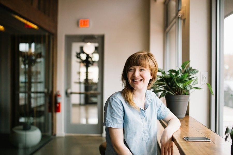 Small business owner smiling in her shop
